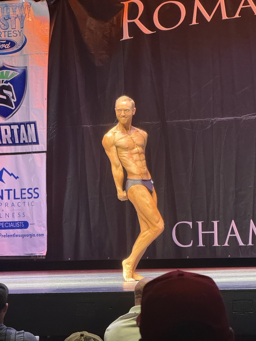 Dalton competing on stage at the Roman Classic bodybuilding show